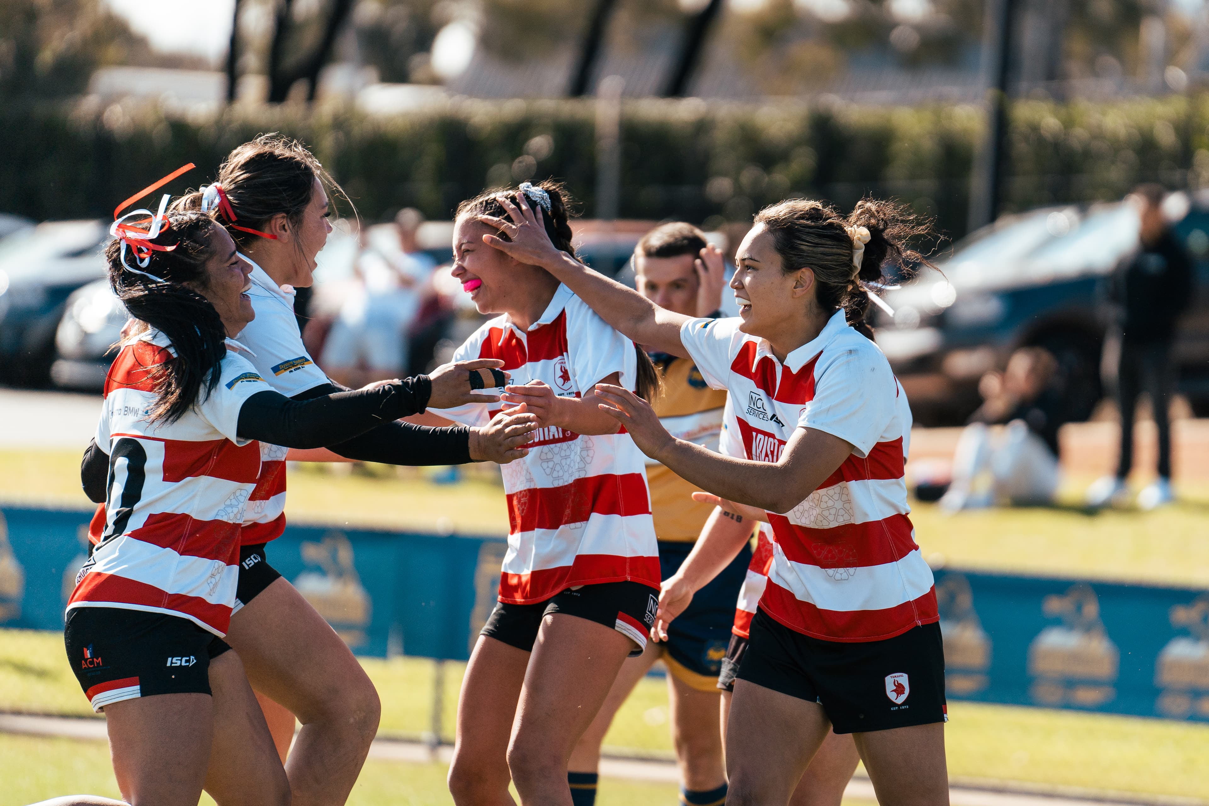 Tuggeranong Vikings Women celebrate a Grand Final try against Uni-Norths Owls.