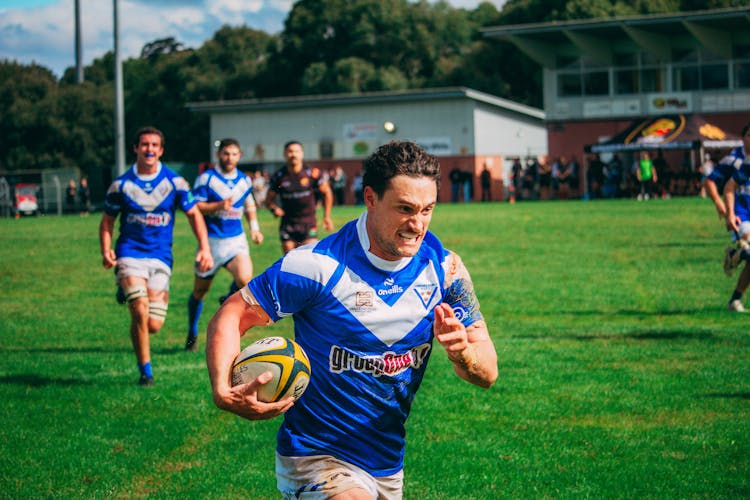 Braiden Oates of the Canberra Royals runs for a try in the corner.